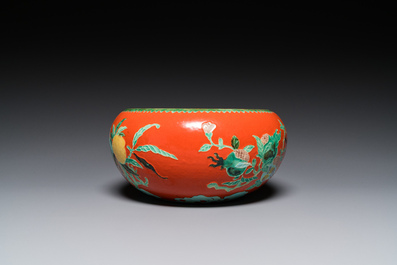 A Chinese relief-decorated alms bowl with wooden lid, Qianlong mark, 19/20th C.