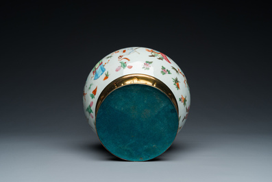 A Chinese Canton famille rose vase with gilt brass mounts, 19th C.