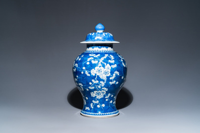 A Chinese blue and white 'prunus on cracked ice' vase and cover, Kangxi