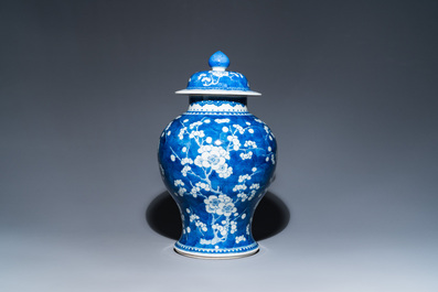 A Chinese blue and white 'prunus on cracked ice' vase and cover, Kangxi
