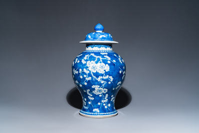 A Chinese blue and white 'prunus on cracked ice' vase and cover, Kangxi