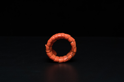 A Chinese red coral bracelet with a dragon's or snake's head, 19th C.