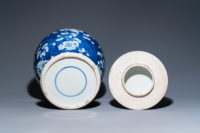 A Chinese blue and white 'prunus on cracked ice' vase and cover, Kangxi