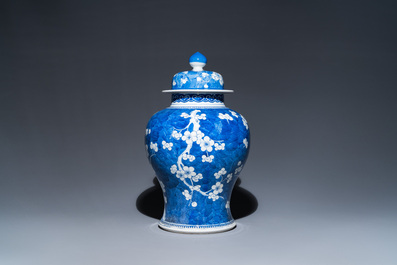 A Chinese blue and white 'prunus on cracked ice' vase and cover, Kangxi