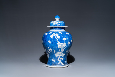 A Chinese blue and white 'prunus on cracked ice' vase and cover, Kangxi