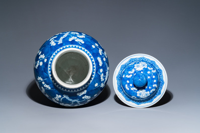 A Chinese blue and white 'prunus on cracked ice' vase and cover, Kangxi