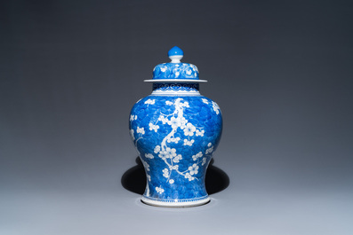 A Chinese blue and white 'prunus on cracked ice' vase and cover, Kangxi