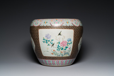 A large Chinese famille rose fish bowl on wooden stand, 19th C.