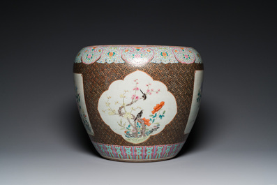 A large Chinese famille rose fish bowl on wooden stand, 19th C.