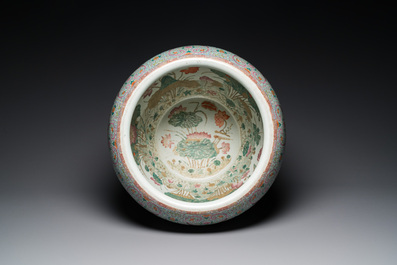 A large Chinese famille rose fish bowl on wooden stand, 19th C.