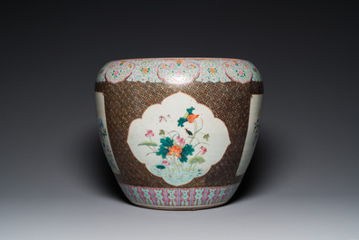 A large Chinese famille rose fish bowl on wooden stand, 19th C.