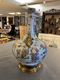 A Chinese Canton famille rose vase with gilt brass mounts, 19th C.