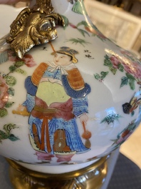 A Chinese Canton famille rose vase with gilt brass mounts, 19th C.