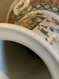 A Chinese famille verte 'playing boys' rouleau vase, 19th C.