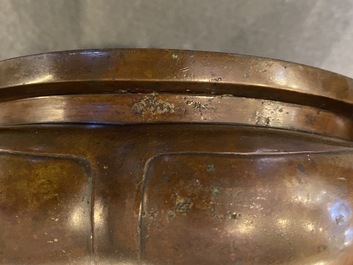 A Chinese lotus-shaped bronze tripod censer, late Ming or early Qing