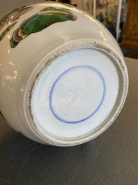 A Chinese famille verte jar with wooden cover and stand, 19th C.