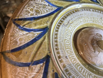 A large Hispano-Moresque lustre-glazed dish with a central bird medallion, Spain, 16th C.