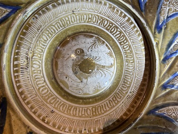 A large Hispano-Moresque lustre-glazed dish with a central bird medallion, Spain, 16th C.