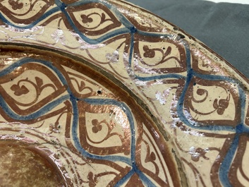 A large Hispano-Moresque lustre-glazed dish with ornamental design, Spain, 16th C.