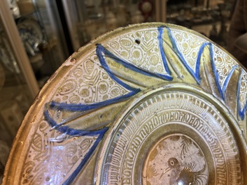 A large Hispano-Moresque lustre-glazed dish with a central bird medallion, Spain, 16th C.