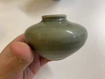 Three Chinese celadon-glazed vases, two stem cups and a blue and white vase, Ming