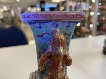 A pair of Chinese famille rose turquoise-ground vases, Qianlong mark, 19/20th C.