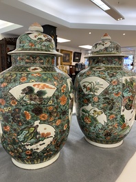 A pair of  Chinese famille verte vases and covers, 19th C.