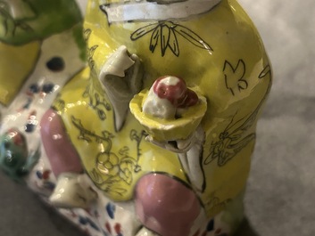 A Chinese famille rose 'Hehe Er Xian' group and a 'Caishen' figure, Qianlong and later