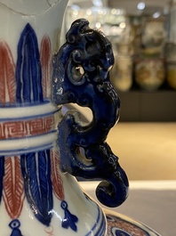 A Chinese blue, white and copper-red 'phoenix' vase, 19/20th C.