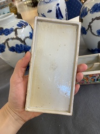 A pair of Chinese blue, white and copper-red vases, a blue and white covered vase and a Canton famille rose box and cover, 19/20th C.
