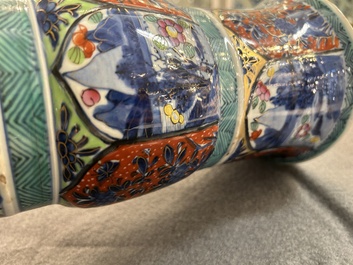 A Chinese blue and white 'gu' vase with European clobbered design, Kangxi