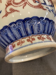 A Chinese blue, white and copper-red 'phoenix' vase, 19/20th C.