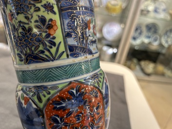 A Chinese blue and white 'gu' vase with European clobbered design, Kangxi