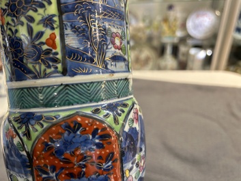 A Chinese blue and white 'gu' vase with European clobbered design, Kangxi