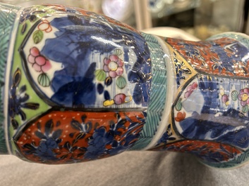 A Chinese blue and white 'gu' vase with European clobbered design, Kangxi