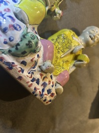 A Chinese famille rose 'Hehe Er Xian' group and a 'Caishen' figure, Qianlong and later