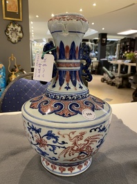 A Chinese blue, white and copper-red 'phoenix' vase, 19/20th C.