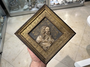 A pair of rare rhombus-shaped Malines alabaster portrait carvings, signed Tobias Tissenaken, end of the 16th C.