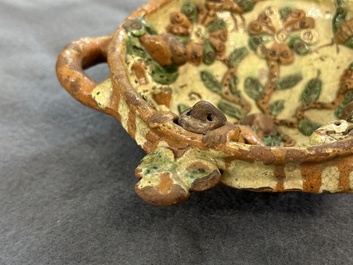A slip-decorated three-handled earthenware bowl, probably Germany, 16/17th C.