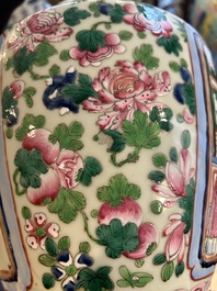 A pair of Chinese famille rose 'court scene' vases, 19th C.
