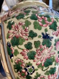 A pair of Chinese famille rose 'court scene' vases, 19th C.