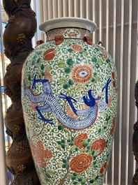A very large Chinese famille verte 'dragon' vase on wooden stand, 19th C.