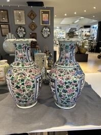A pair of Chinese famille rose 'court scene' vases, 19th C.