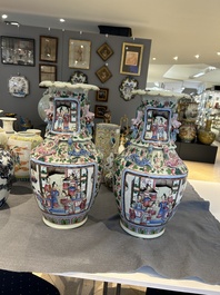 A pair of Chinese famille rose 'court scene' vases, 19th C.