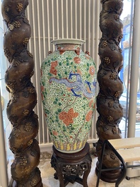 A very large Chinese famille verte 'dragon' vase on wooden stand, 19th C.