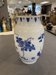 A Chinese blue and white vase with floral design, Transitional period