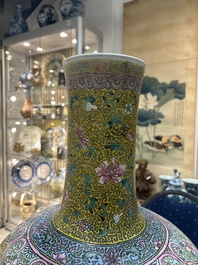 A large Chinese famille rose yellow-ground bottle vase, Qianlong mark, 19th C.