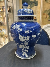 A Chinese blue and white 'prunus on cracked ice' vase and cover, Kangxi