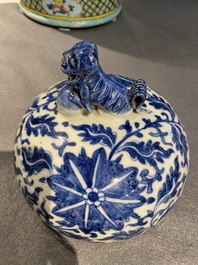 A pair of Chinese blue and white covered vases with floral sprigs, 19th C.