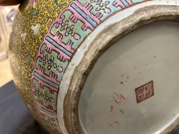 A large Chinese famille rose yellow-ground bottle vase, Qianlong mark, 19th C.
